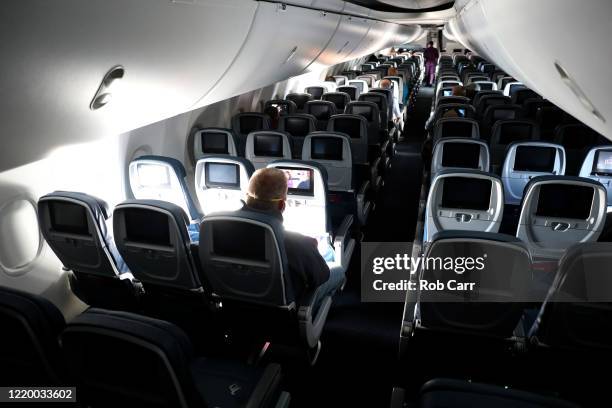 Passengers are seen in a cabin mid-flight on a Baltimore, Maryland bound Delta flight from Hartsfield-Jackson Atlanta International Airport on April...