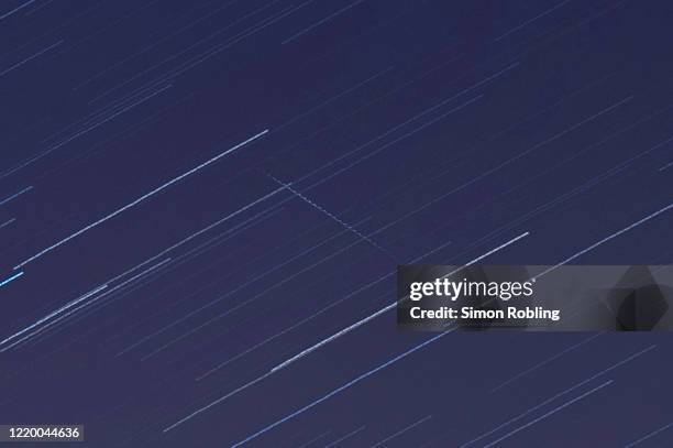 Meteor crosses the sky illuminated under the stars on a clear night on April 21, 2020 in London, England. The clear skies created by the New Moon...