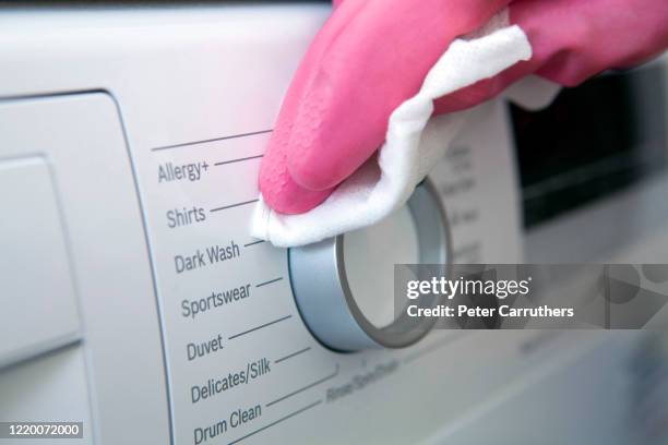 santizing surfaces in the home - washing machine stock pictures, royalty-free photos & images