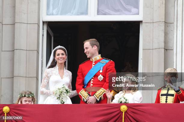 Prince William and his bride Catherine Middleton with bridesmaids Grace Van Cutsem and Margarita Armstrong-Jones, stand on the balcony of Buckingham...