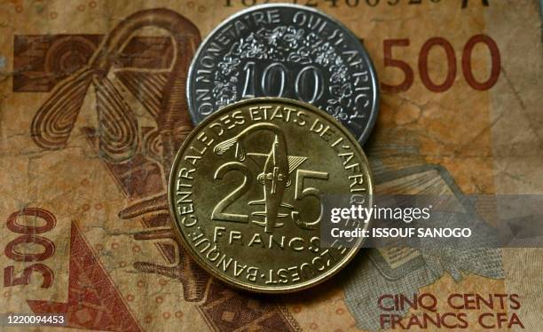 Small change of the CFA franc currency is seen in Abidjan on June 14, 2020. - In most of the fourteen countries that use the CFA franc in West and...