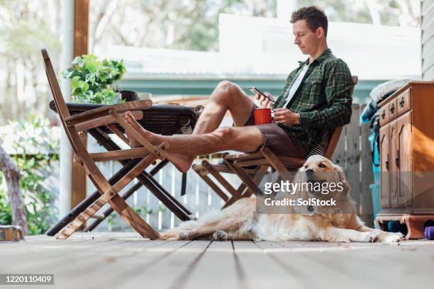 relaxing at the weekend - feet on table stock pictures, royalty-free photos & images