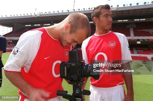 Freddie Ljungberg and Giovanni van Bronckhorst of Arsenal check out the camera during the Arsenal 1st team photocall on August 12, 2003 in London,...