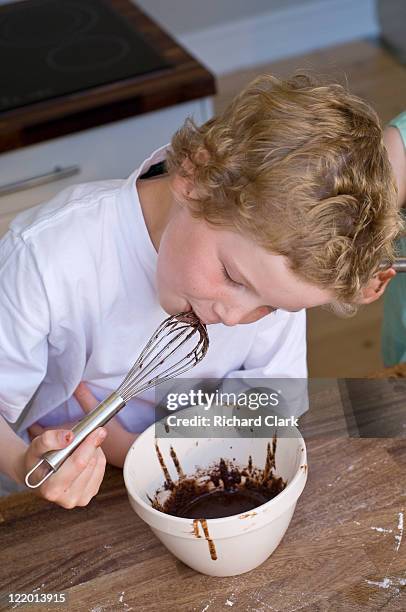 boy (5-7 years) making chocolate sauce - ffi feature stock pictures, royalty-free photos & images