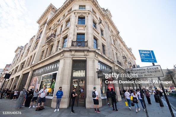 People queue around the block for Nike Town on Oxford Circus