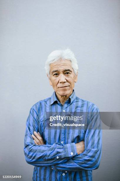 senior man contemplating - content japanese ethnicity stock pictures, royalty-free photos & images