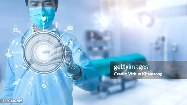 futuristic innovative corona covid-19 virus doctor wear mask virtual digital ai infographic data tech. coronavirus 2019-ncov treatment analysis screen in hospital laboratory against epidemic virus - n tech stock pictures, royalty-free photos & images