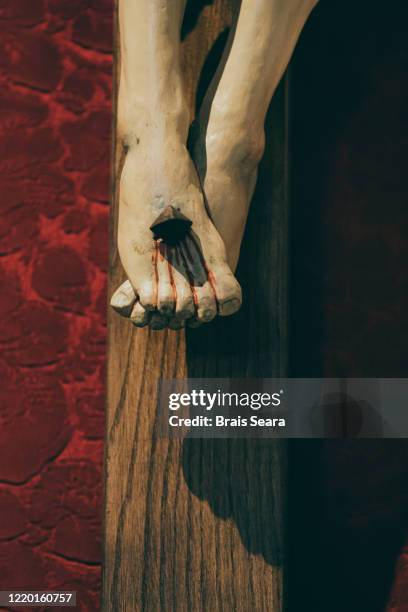 crucifixion - feet torture stock-fotos und bilder