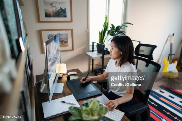 female designer working from her home office - freelance work stock pictures, royalty-free photos & images