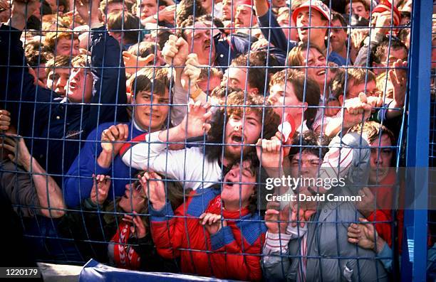 Supporters are crushed against the barrier as disaster strikes before the FA Cup semi-final match between Liverpool and Nottingham Forest played at...