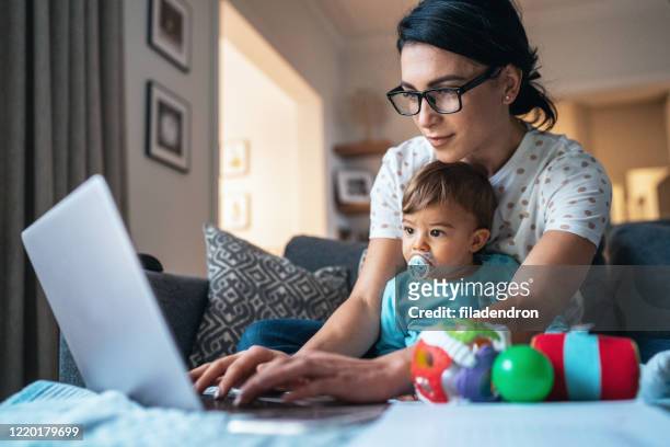 working at home mom - child wearing adult glasses stock pictures, royalty-free photos & images