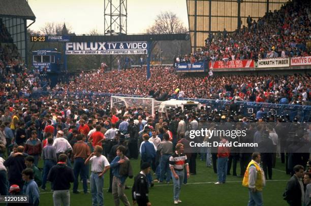 Supporters are crushed against the barrier as disaster strikes before the FA Cup semi-final match between Liverpool and Nottingham Forest played at...