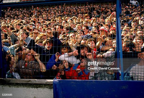 Supporters are crushed against the barrier as disaster strikes before the FA Cup semi-final match between Liverpool and Nottingham Forest played at...