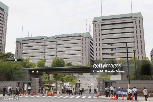 Photo taken on June 15 shows the headquarters of Japan's Defense Ministry in Tokyo. Japan announced the same day that it will halt the process of...