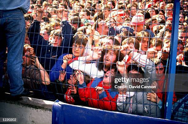 Supporters are crushed against the barrier as disaster strikes before the FA Cup semi-final match between Liverpool and Nottingham Forest played at...