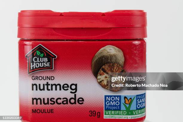 In this photo illustration, a front view of a small container with ground nutmeg.