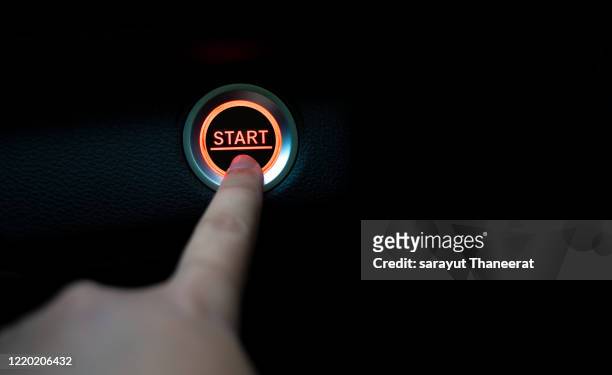 the fingers are pressing the start push button. startup concept. - beginnings stock pictures, royalty-free photos & images