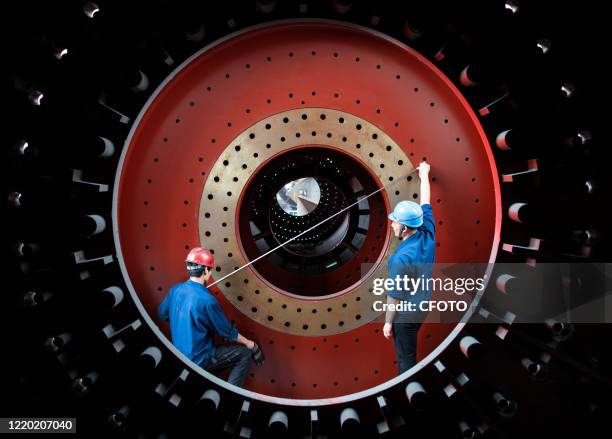 Workers produce large building materials and equipment for export to countries along the Belt and Road. Hai 'an city, Jiangsu Province, China, June...