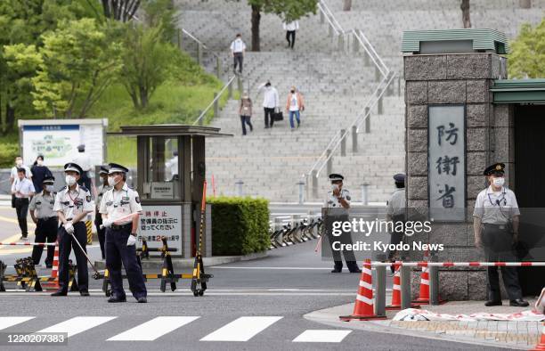 Photo taken on June 15 shows the headquarters of Japan's Defense Ministry in Tokyo. Japan announced the same day that it will halt the process of...