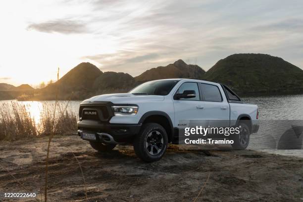 ram 1500 pick-up next to lake in a sunset - truck stock pictures, royalty-free photos & images