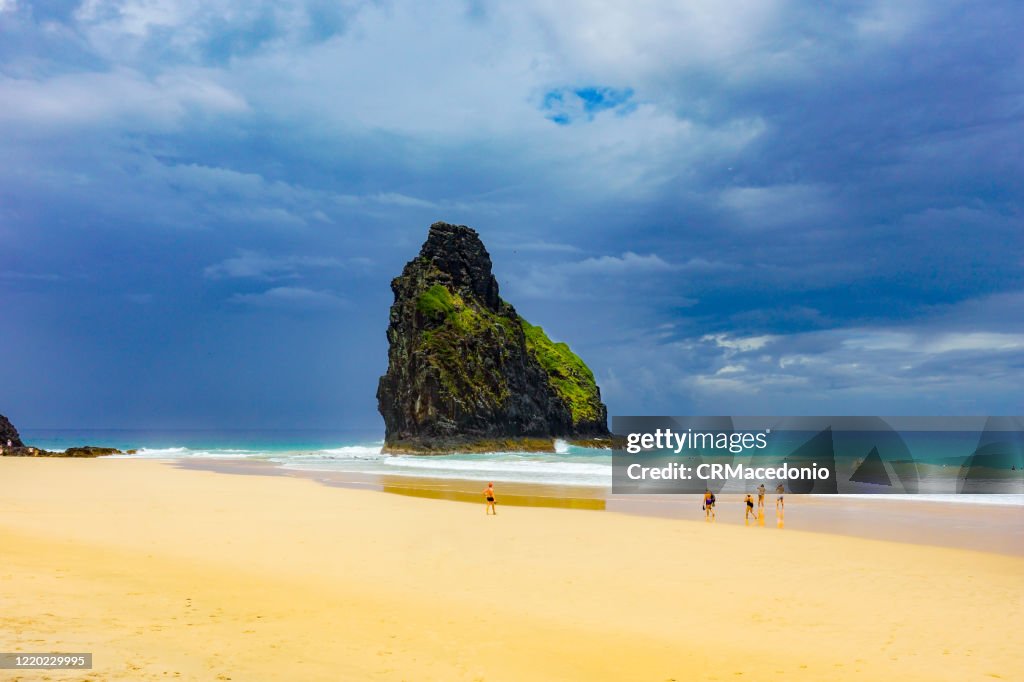 Two Brothers rock formation at Cacimba Beach. One of the longest beaches in Fernando de Noronha, is a must go in the island, especially for surfers.
