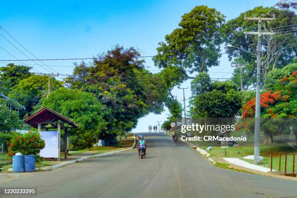 the state and also federal highway crosses the small town, where residents and tourists circulate. - pernambuco state stock-fotos und bilder