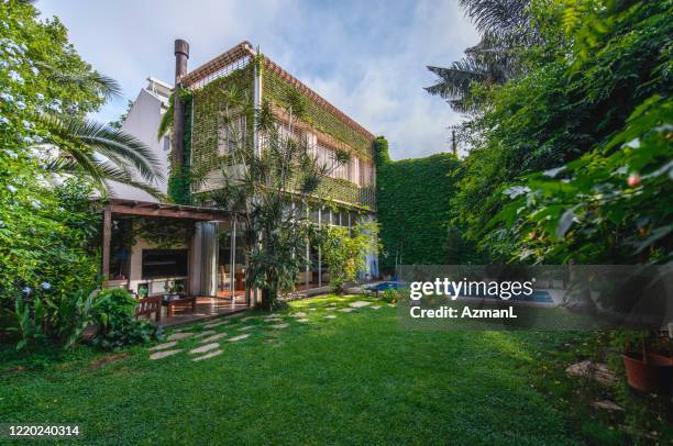 backyard view of modern two-story house in buenos aires - backyard deck stock pictures, royalty-free photos & images