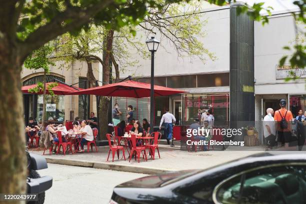 People eat at outdoor seating at a restaurant in Montclair, New Jersey, U.S., on Monday, June 15, 2020. New Jersey enters Phase 2 on Monday, opening...