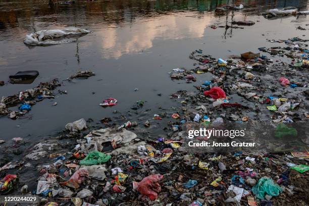 Garbage bags float gently by on the Bisnumati River in Kathmandu. Bishnumati River is polluted by different chemicals and effluents from various...