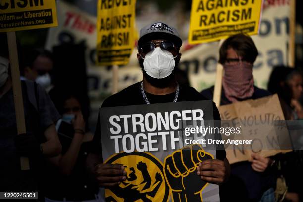 Protesters rally near Lafayette Park on June 15, 2020 in Washington, DC. Protesters rallied to mark two weeks after law enforcement cleared...