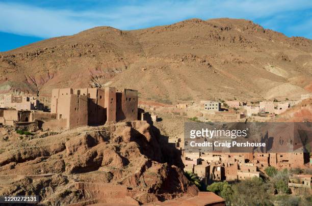 historic kasbah on hill above the village of ait oudinar, dades valley. - country geographic area stock pictures, royalty-free photos & images