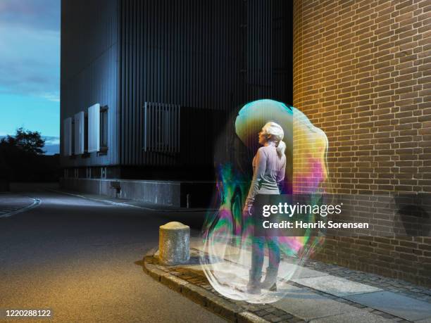 young female in soapbubble - people inside bubbles fotografías e imágenes de stock