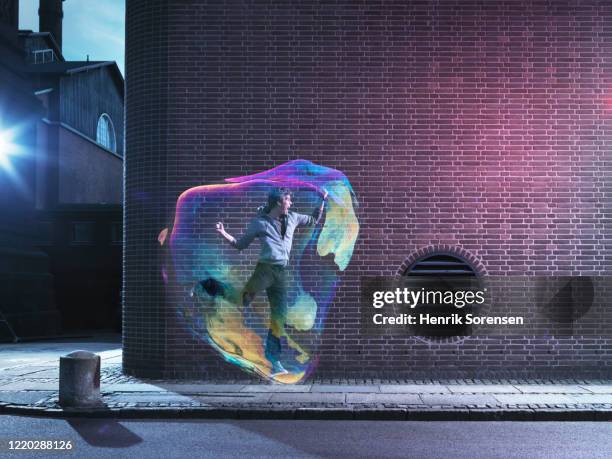 young male in soapbubble - big city life stock pictures, royalty-free photos & images