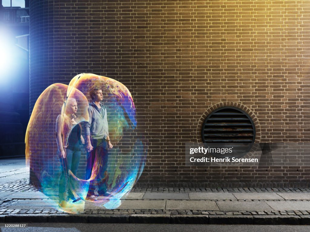 Young couple in soapbubbles