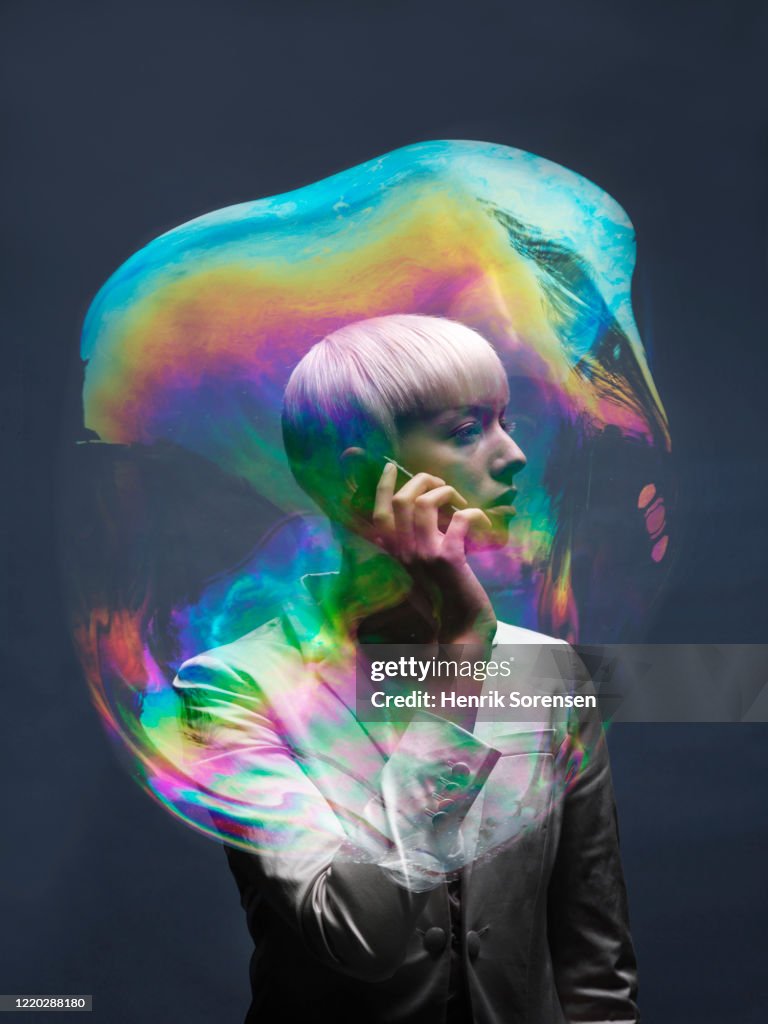 Young female in soapbubble