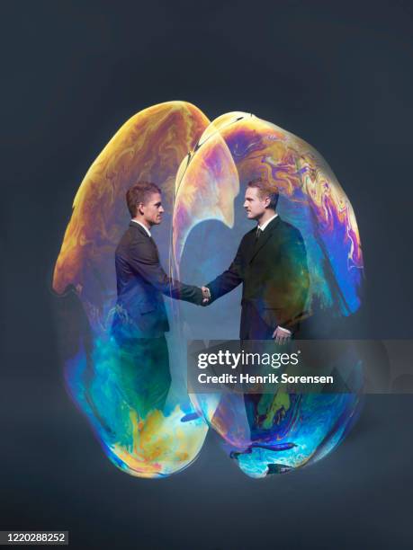 young male in soapbubble - handshake abstract stock pictures, royalty-free photos & images