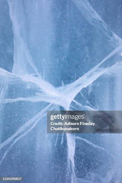 texture of ice of baikal lake in siberia with ice crack - calving stock pictures, royalty-free photos & images