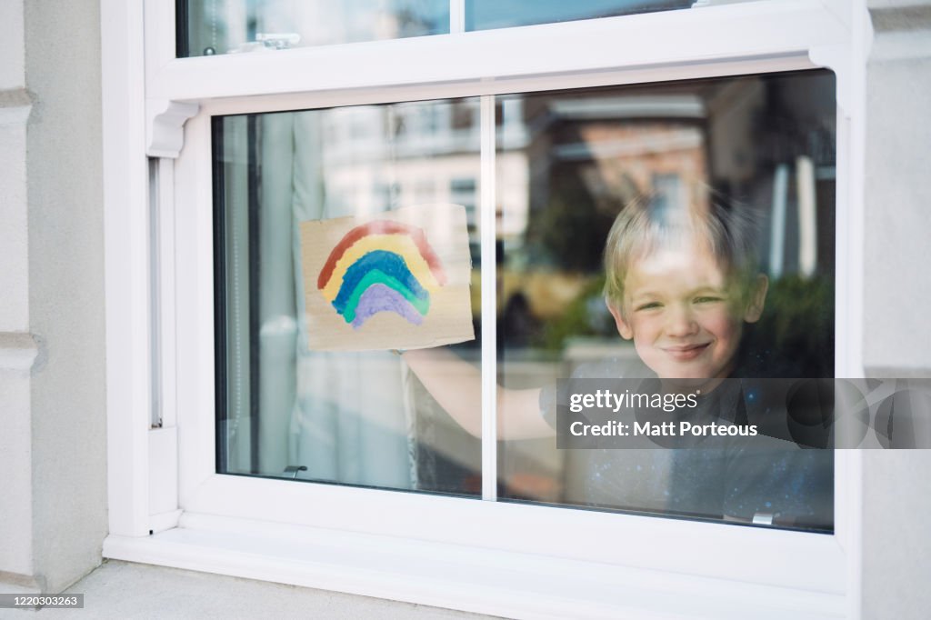 Child painting rainbow