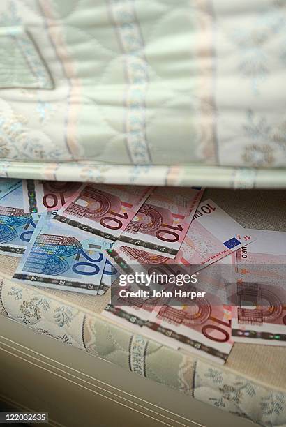 euros under the mattress - hiding money stock pictures, royalty-free photos & images
