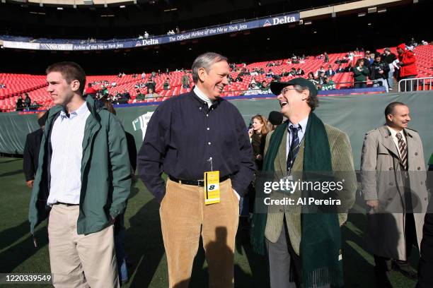 New York State Governor George Pataki speaks with New York Jets President Jay Cross when he attends the New York Jets vs the Oakland Raiders game at...