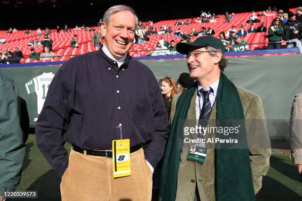 New York State Governor George Pataki speaks with New York Jets President Jay Cross when he attends the New York Jets vs the Oakland Raiders game at...