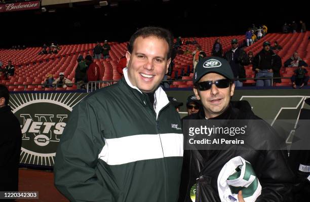 Michael Imperioli speaks with New York Jets Assistant General Manager Mike Tannenbaum when he attends the New York Jets vs the Buffalo Bills game at...