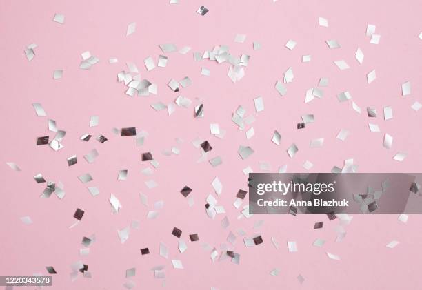 glitter glowing abstract festive background with confetti, design of greeting card for holidays - foil texture silver stock pictures, royalty-free photos & images