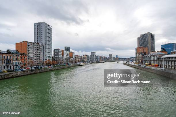 river meuse through city, liege, wallonia, belgium - liege stock pictures, royalty-free photos & images