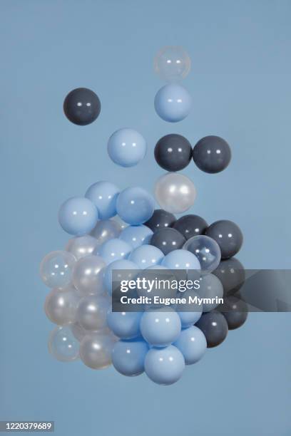 abstract multi-colored spheres on blue background - rubiks kub bildbanksfoton och bilder
