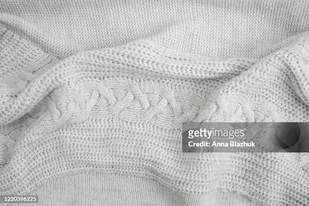 knitted warm beige sweater texture close up, piece of knit fabric - wool stock pictures, royalty-free photos & images