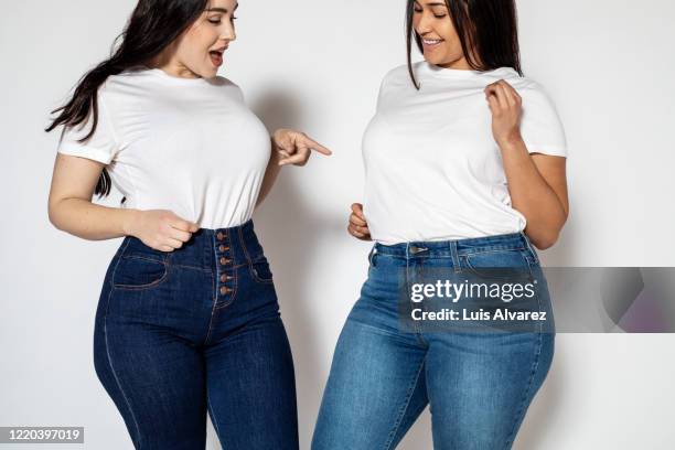 portrait of a two woman wearing similar outfits - plus size fashion stock pictures, royalty-free photos & images