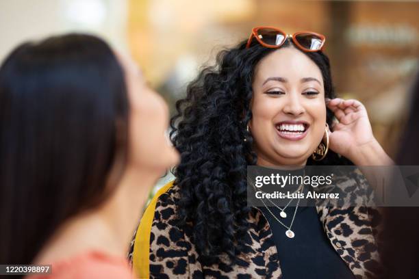 beautiful woman talking with her friends outdoors - voluptuous black women stockfoto's en -beelden