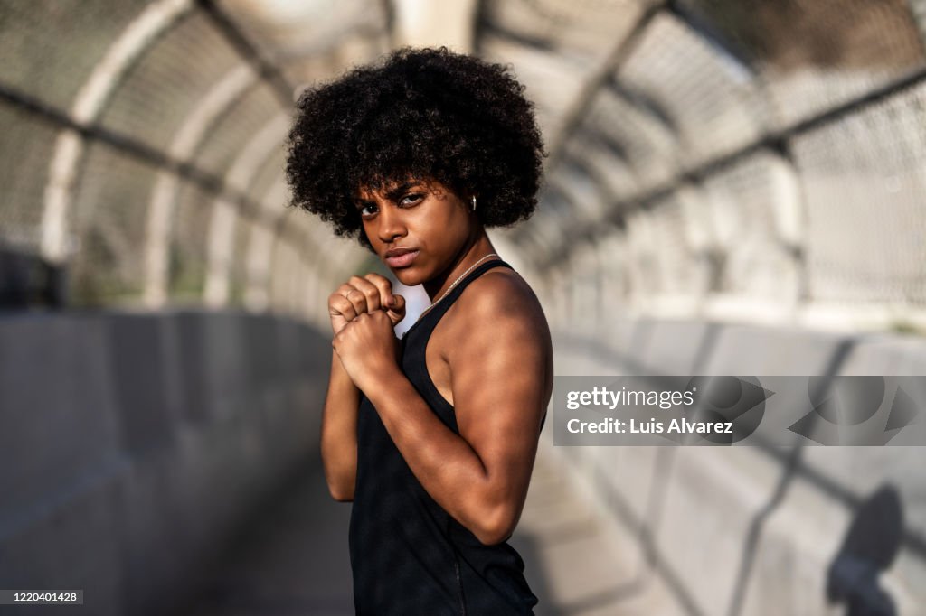Determined athletic woman in boxing stance