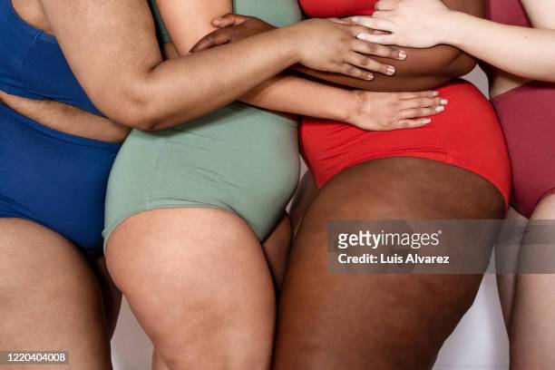 group of a women in underwear with fat legs - cellulite foto e immagini stock